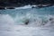 Boy body surfer playing in big Hawaiian Waves