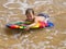 Boy with a bodyboard.