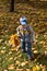 Boy with bouquet of autumn flowers