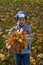 Boy with bouquet of autumn flowers