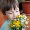 Boy with the bouquet of wildflowers
