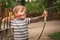 Boy with a bow and arrow. Children and sports