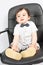 Boy in bow tie sits in armchair desk chair symbol of young man business