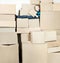 Boy with box sitting on heap boxes