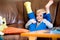 Boy with broken leg in cast sitting on couch.