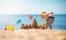 Boy building a sandcastle at the beach in summer