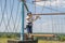 Boy on the cable car in the sports rope extreme park