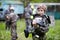 Boy in camouflage holds a paintball gun barrel up