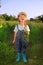 Boy with a carrot and a watering can