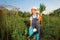 Boy with a carrot and a watering can