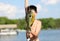 Boy catching a fish in Michigan lake during summer, fishing activity with family. Fun child.