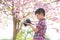 Boy checking photo in camera at park