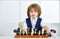 The boy with chess. Clever ancient game. Logic and thinking, education.