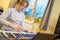 Boy with chickenpox playing piano