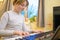 Boy with chickenpox playing piano