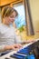 Boy with chickenpox playing piano