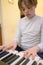 Boy with chickenpox playing piano