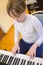 Boy with chickenpox playing piano