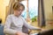 Boy with chickenpox playing piano