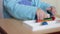 Boy child arms sculpts figures out of plasticine on table