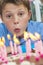 Boy Child Blowing Out Birthday Cake Candles