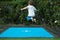 Boy child jumping on trampoline