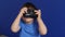 Boy child photographer with a plastic camera soap dish photographs