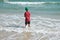 Boy child playing in the sea. Child splashing in the water autdoor. Your holidays at sea. Games in the ocean.