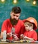 Boy, child in protective helmet makes by hand, repairing, does crafts with dad. Father with beard and little son in