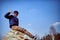 boy child sitting on a rock. outdoor recreation.