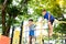 Boy climb on the rope fence