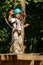 boy at climbing activity in high wire forest park