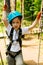 boy at climbing activity in high wire forest park