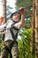 boy at climbing activity in high wire forest park