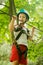 boy at climbing activity in high wire forest park