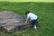 Boy Climbing Large Rock At Park