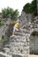 boy climbs the ruins of an ancient building
