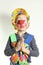 Boy clown with red nose and yellow cap