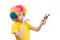 The boy in clown wig with wooden toys and whistle