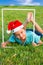 Boy in a clownish cap of Santa Claus