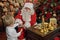 Boy with Cochlear Implants Seal Letter To Santa Claus For New Year
