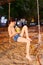 Boy with coconut on the beach swing