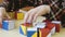 Boy collecting a pattern using colored cubes