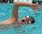 A boy competes in free style swimmmingutterfly