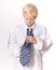 Boy Concentrating on Tying Men\'s Necktie