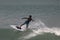 The boy control the surf board as he learn surfing in Lagos popular beach, Tarkwa bay, Lagos Nigeria