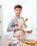 Boy cooking in home kitchen, making dough, healthy food concept