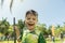 Boy in costume smiling with his face covered with foam