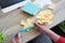 Boy creating paper flower for mom. Mother day, DIY on quarantine or online education concept. Soft focus