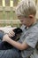 Boy cuddling up with pet rabbit